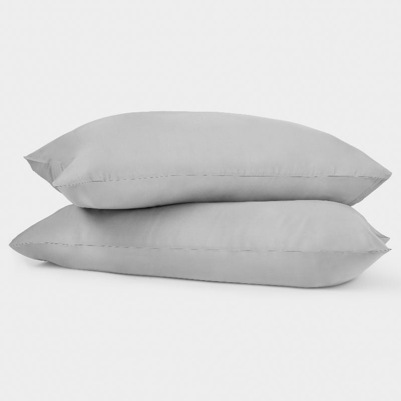 two grey pillows stacked