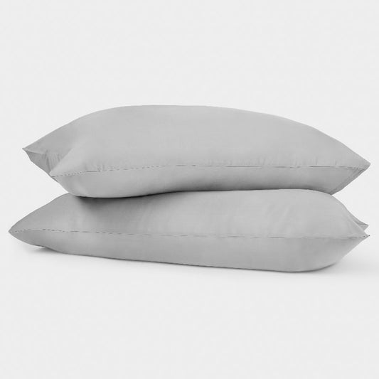two grey pillows stacked 