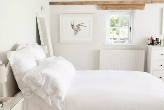 White bedroom with white bed