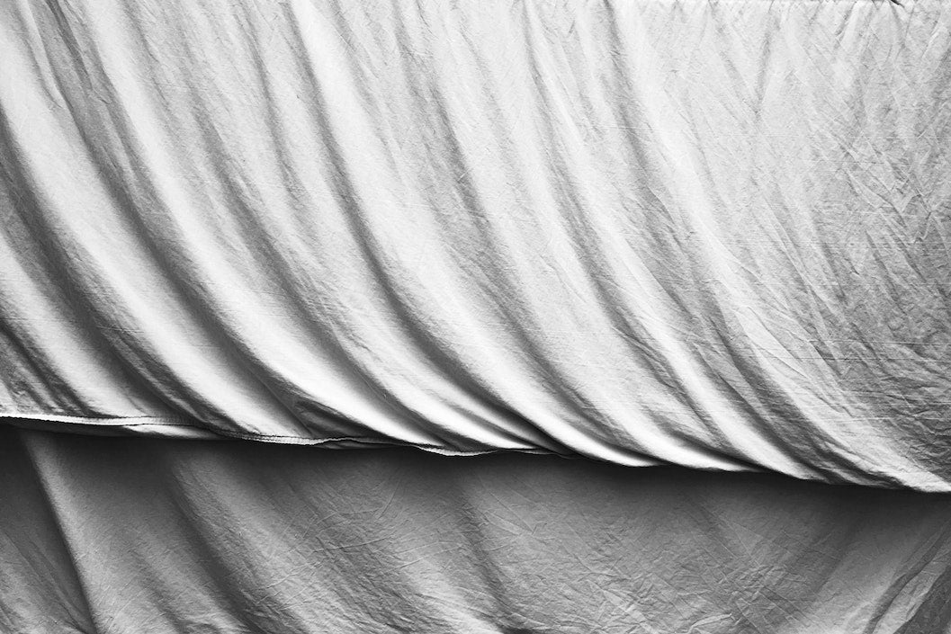 Fresh white bed sheets