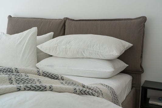 stacked pillows on bed